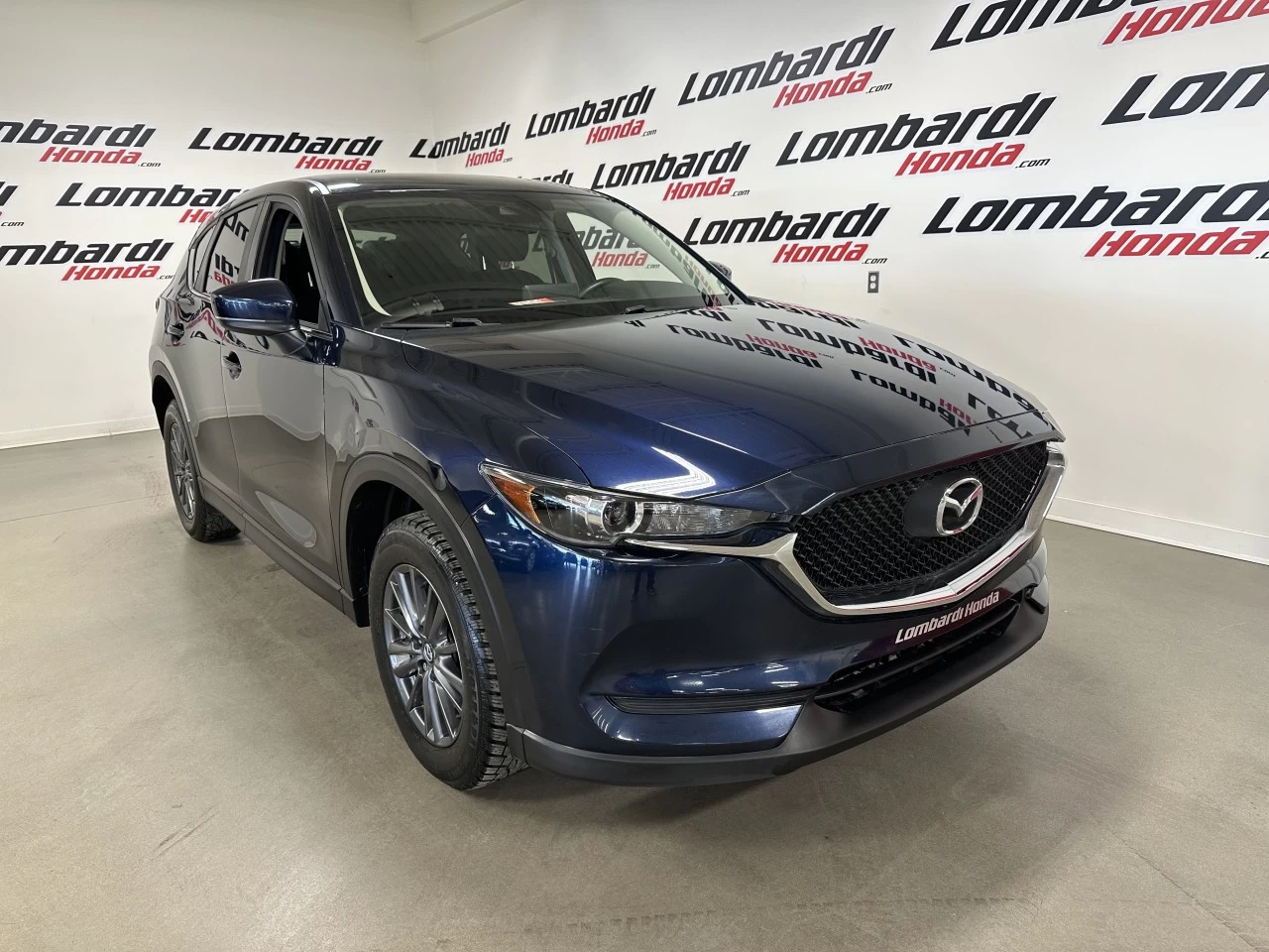 2021 Mazda CX-5 GX https://www.lombardihonda.com/resize/b990ff35b810a3abc0cc817b2ca24889-1