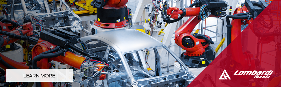 Assembly robots in a Honda factory, showcasing electrification at Lombardi Honda.