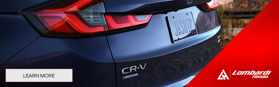 Image of a Honda CR-V Hybrid SUV parked on the side of the highway, Available at Lombardi Honda in Montreal