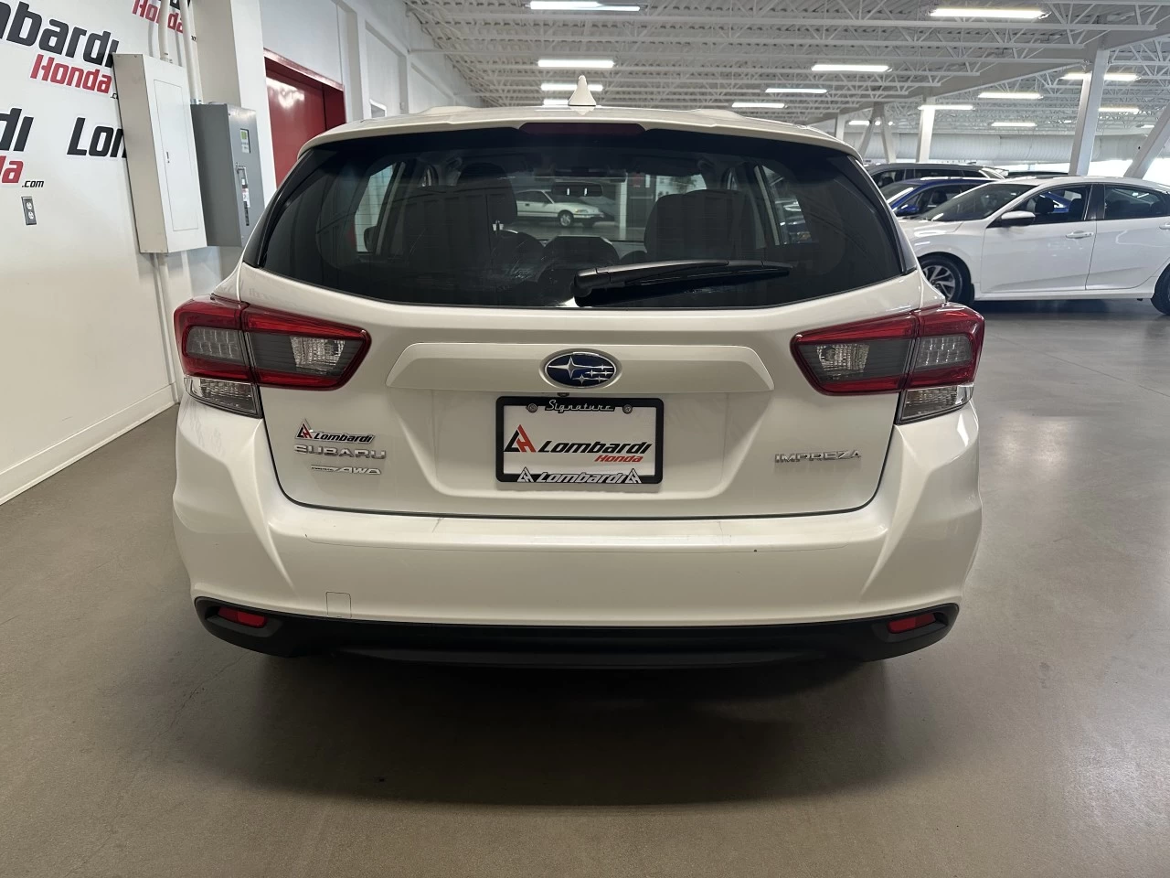 2022 Subaru Impreza
                                                    Touring Image principale