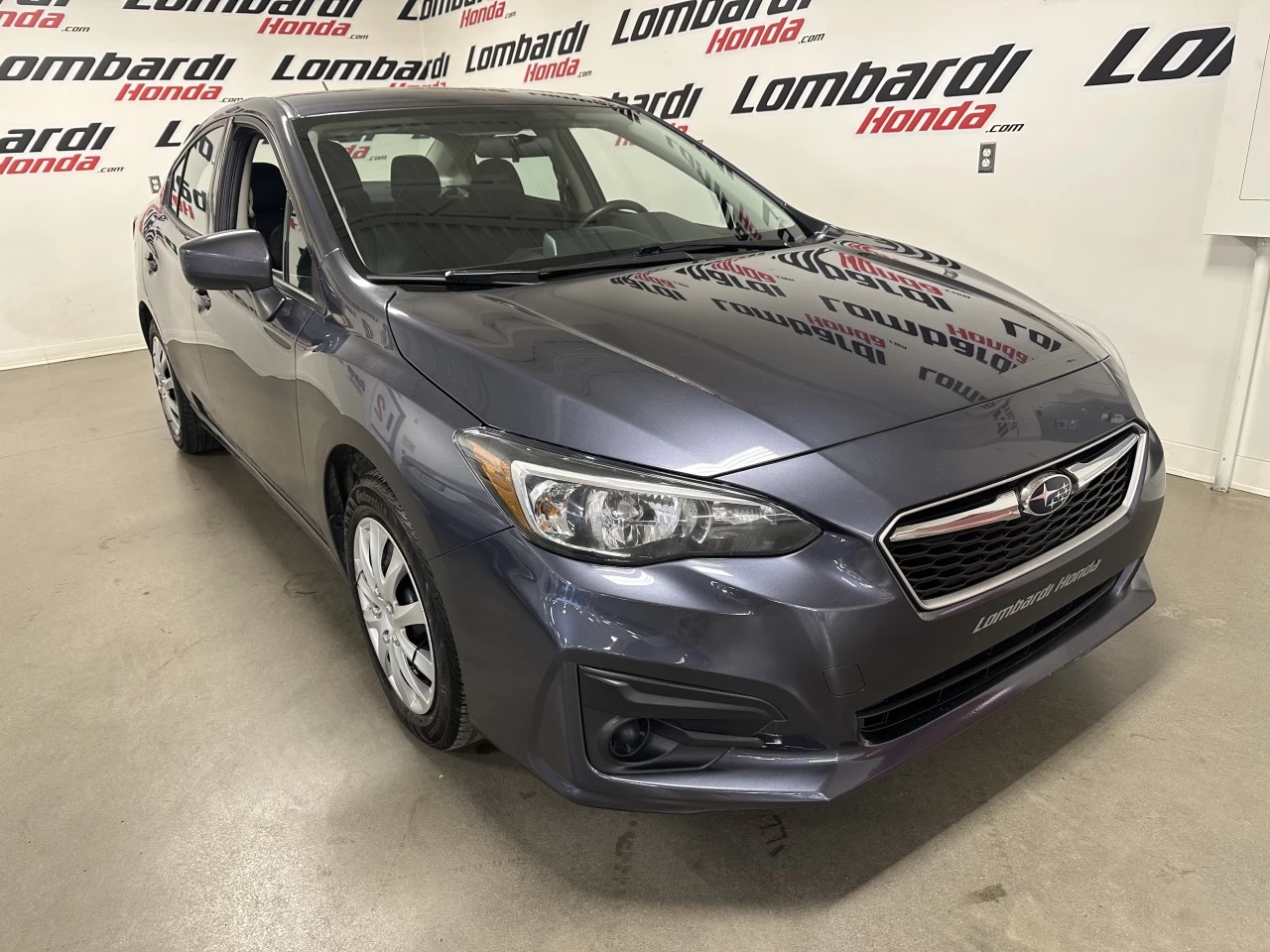 2017 Subaru Impreza Convenience https://www.lombardihonda.com/resize/b990ff35b810a3abc0cc817b2ca24889-1